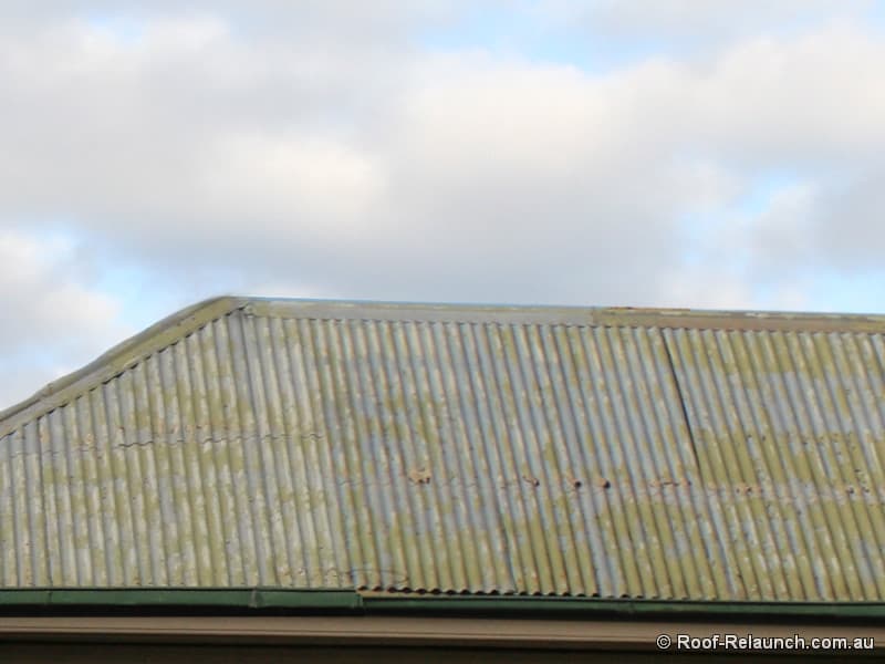 Closeup of very old and damaged metal roof