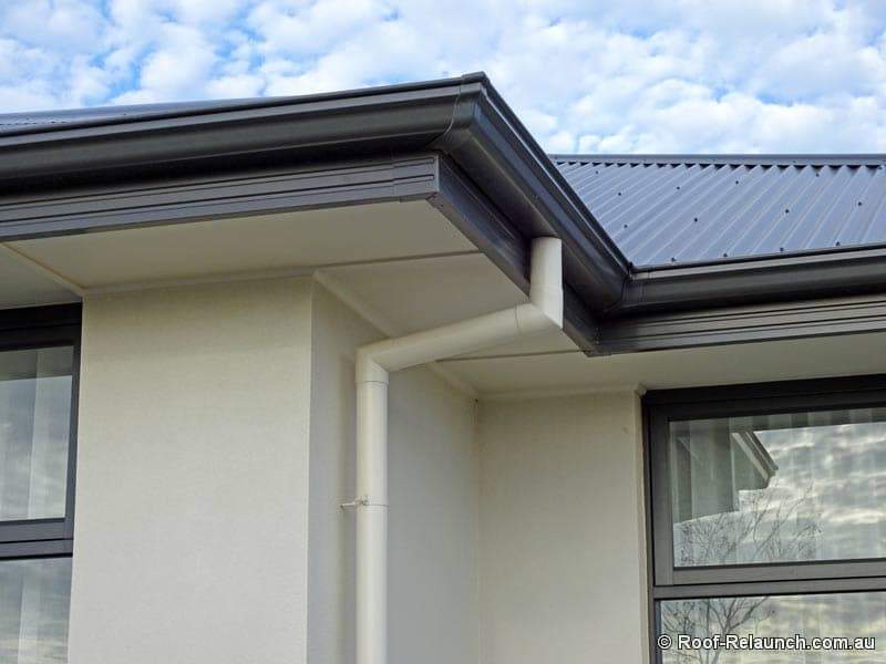 Modern home, with newly-installed gutters, downpipe and fascia capping