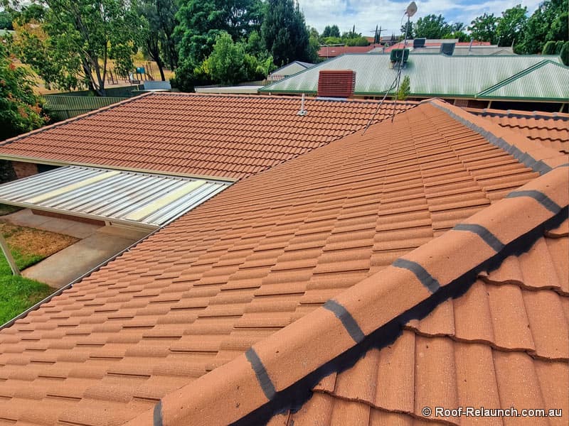 Tile roof, after cleaning and Flexi point ridge capping restoration, at Greenwith